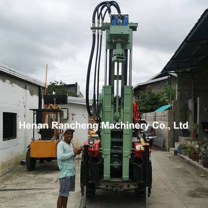Machine de forage hydraulique de puits d'eau DTH 200m Tracteur pneumatique portable Forage monté